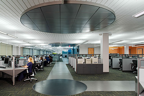 a group of people working in an office.