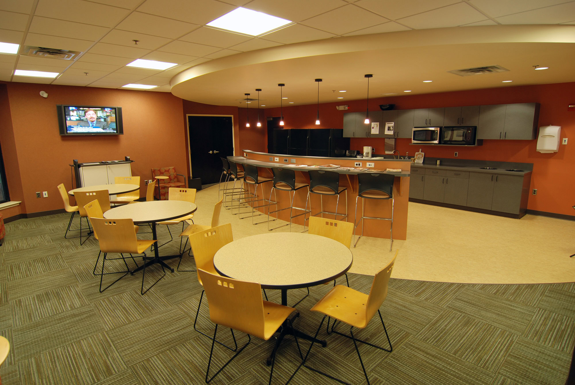 a room with tables and chairs.