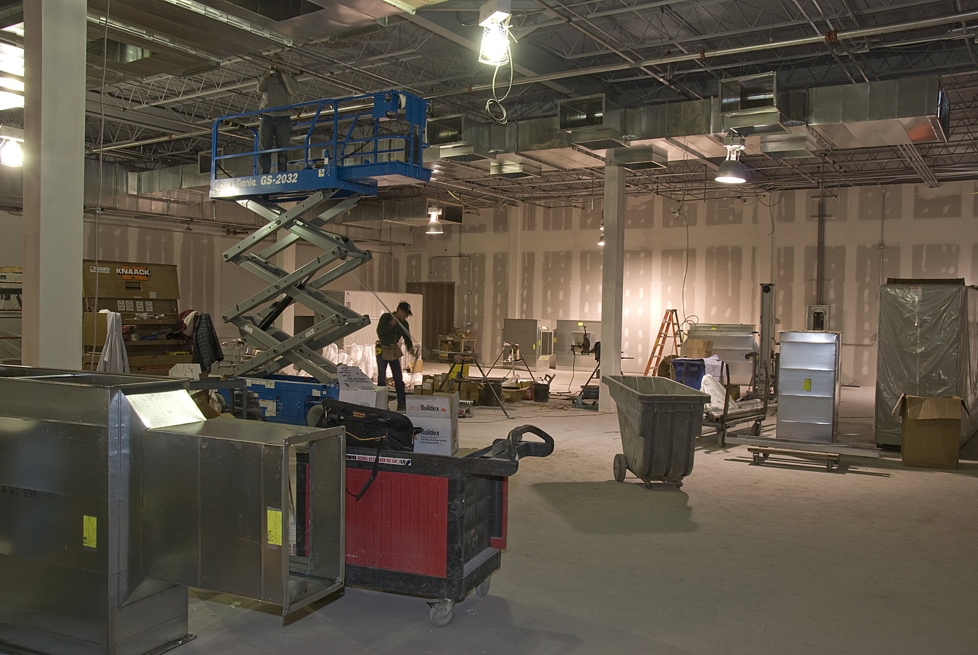 a man standing in a large warehouse.